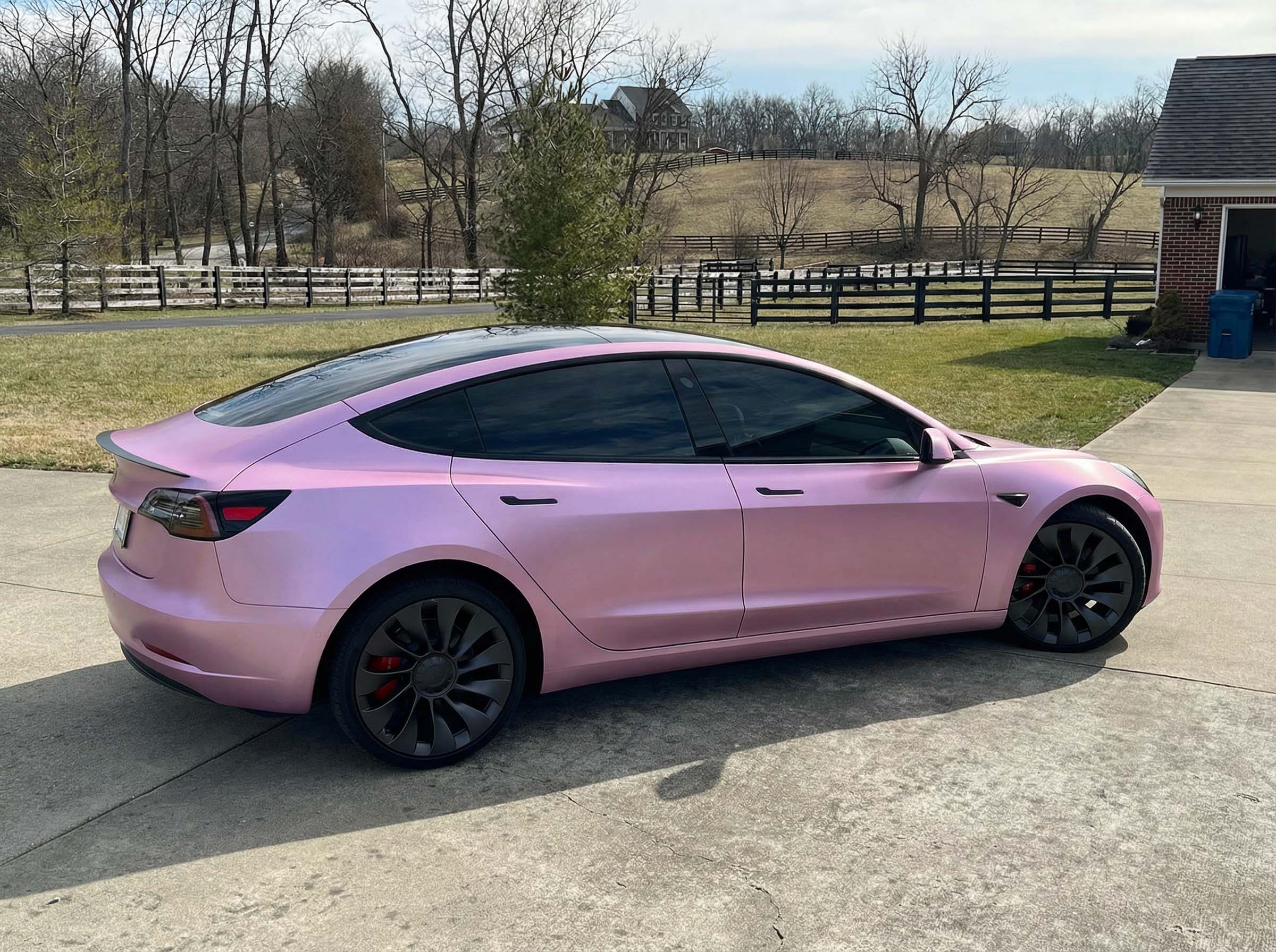 Tesla Model 3 wrapped in Avery Satin Awesome Orchid in a studio